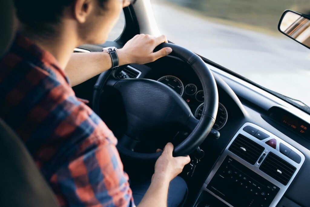 a man driving his car