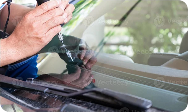 A technician using glazier tools and repairing to fix crack