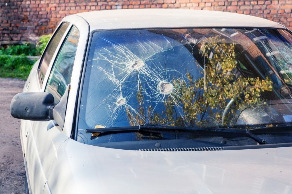 Broken car glass. Few blows to glass