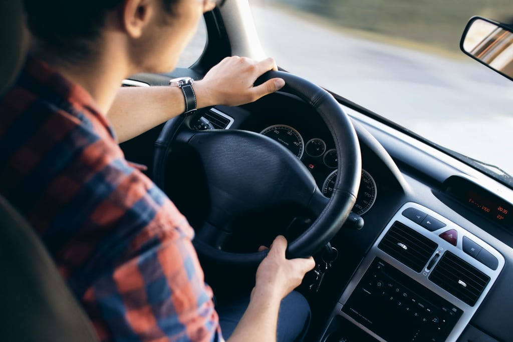 a man driving his car