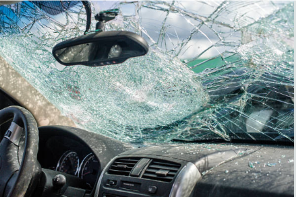 A car windshield is broken