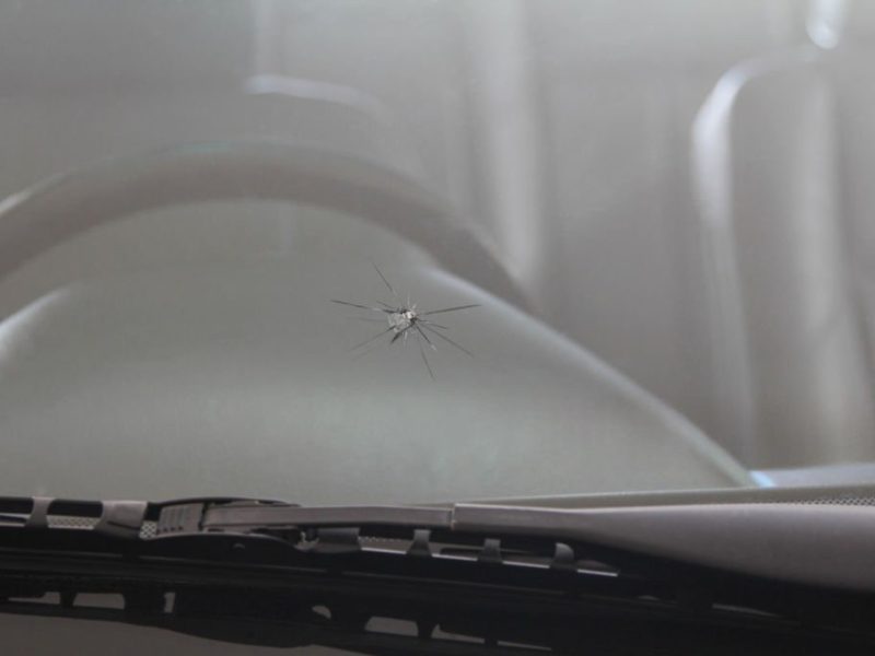 Automobile-windshield-cracks-caused-by-splashing-debris