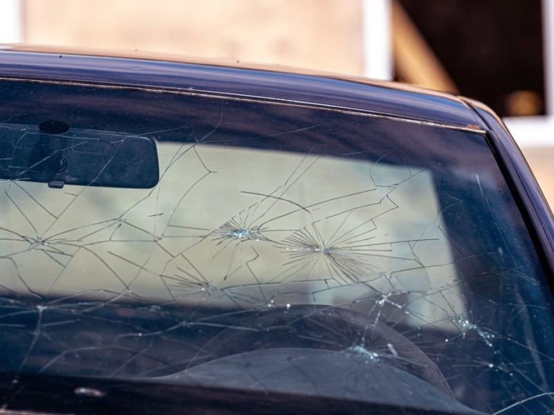 Broken-windshield-on-a-car.-Damaged-glass-on-a-car_17388337ce