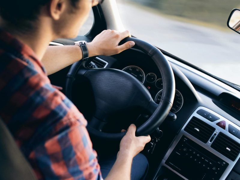 a man driving his car