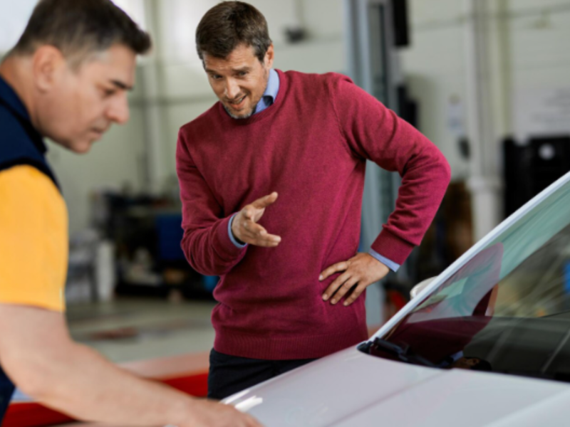 A technician is checking windshield need repair or replacement