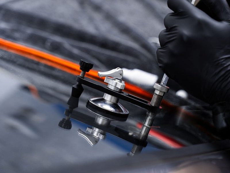 Windshield crack repair using resin injection.