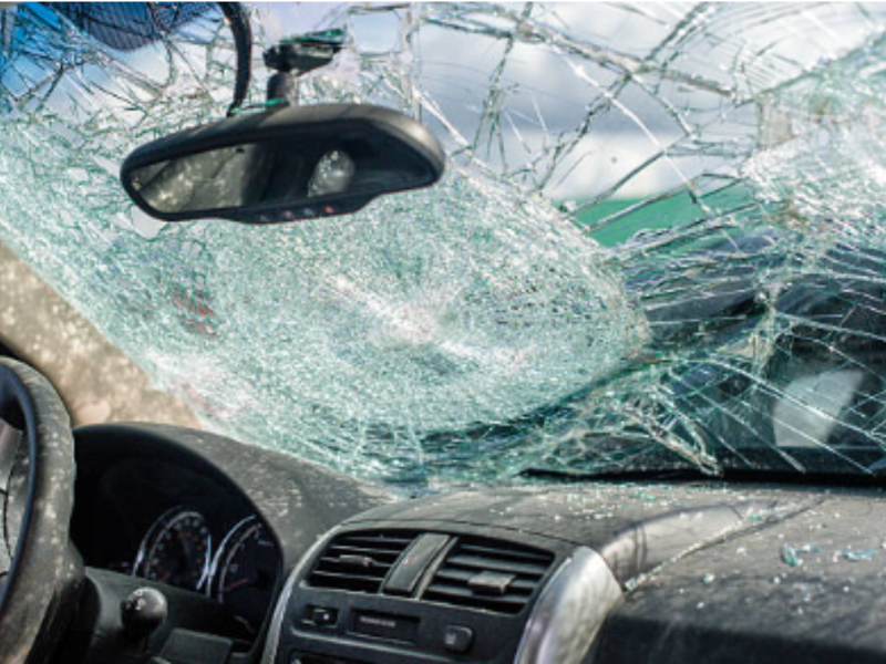 A car windshield is broken